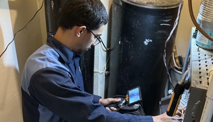 Technician Checking Furnace Technician Checking Furnace