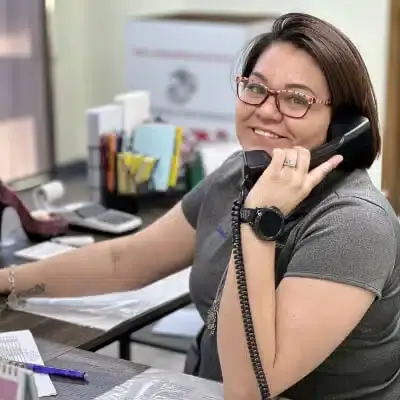 Woman Anserwing Phone In Office